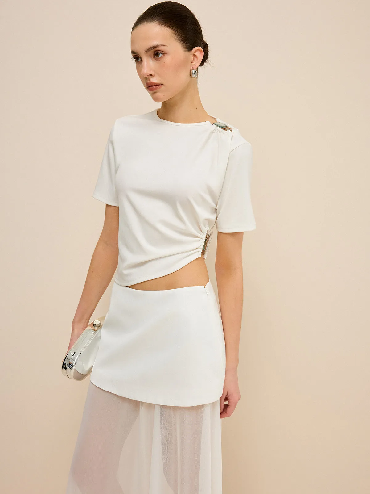Asymmetrical Buckle Detail Cut-Out Top sold by COMMENSE