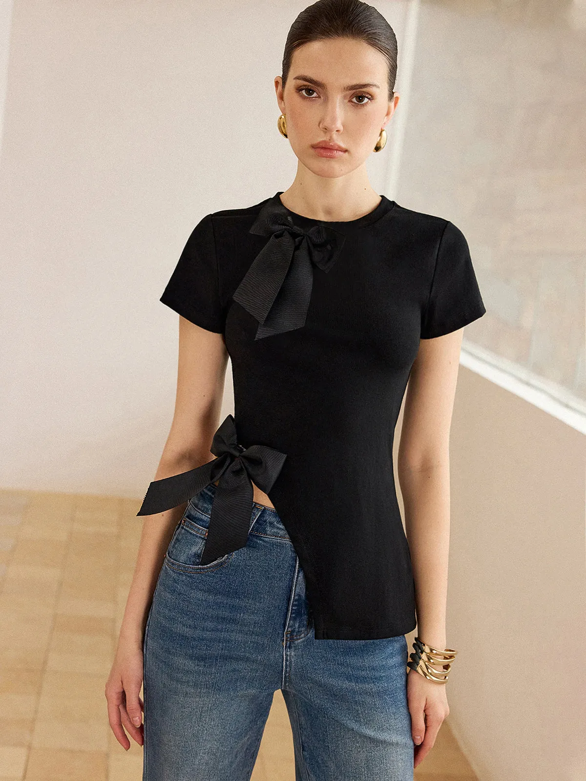 3D Bow-Detailed Top with Asymmetric Hem sold by COMMENSE