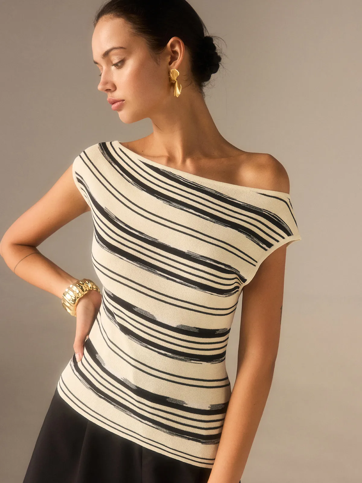 Asymmetric Off-Shoulder Striped Knit Top sold by COMMENSE