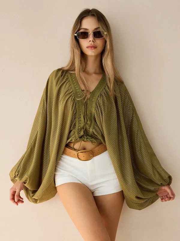 Semi-Sheer Striped Lace-Up Blouse with Batwing Sleeves sold by COMMENSE