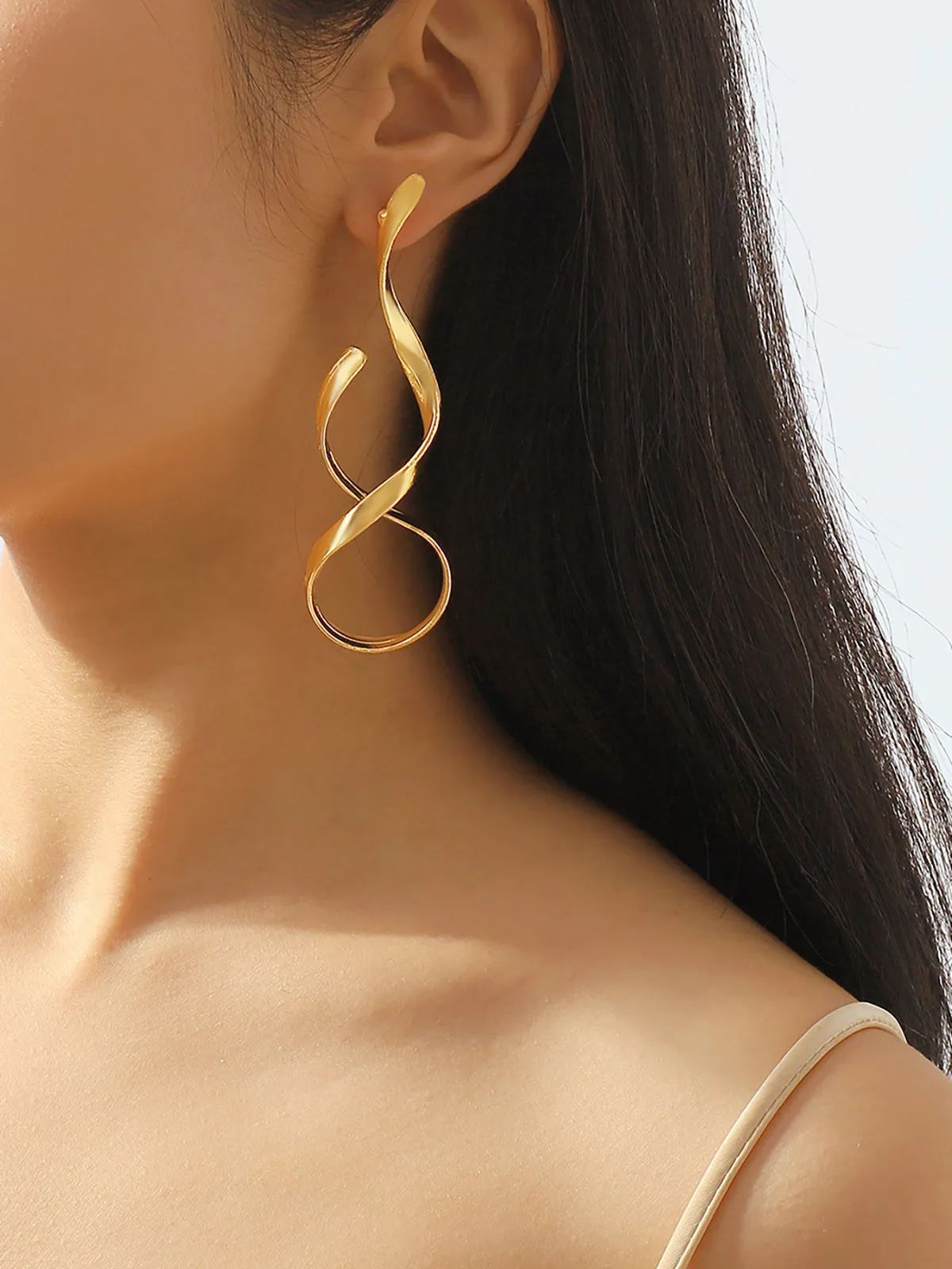 Golden Twisted Drop Earrings sold by COMMENSE