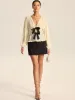 Pleated V-Neck Bow Blouse sold by COMMENSE