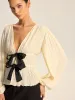Pleated V-Neck Bow Blouse sold by COMMENSE