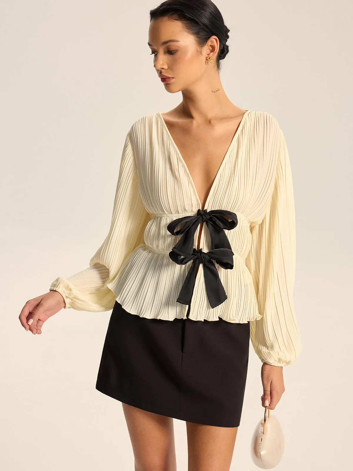 Pleated V-Neck Bow Blouse sold by COMMENSE