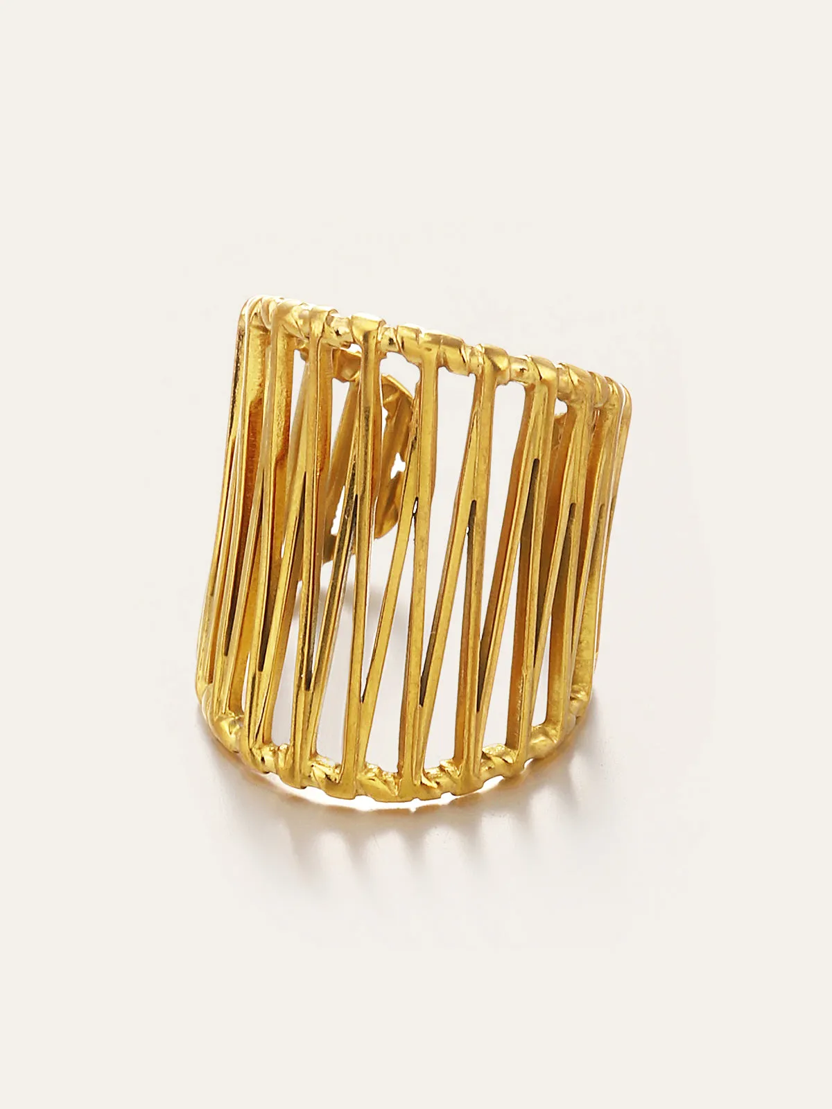 Golden Geometric Cut-Out Ring sold by COMMENSE