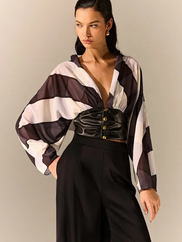 Semi-Sheer Striped Panel Faux Leather Top sold by COMMENSE