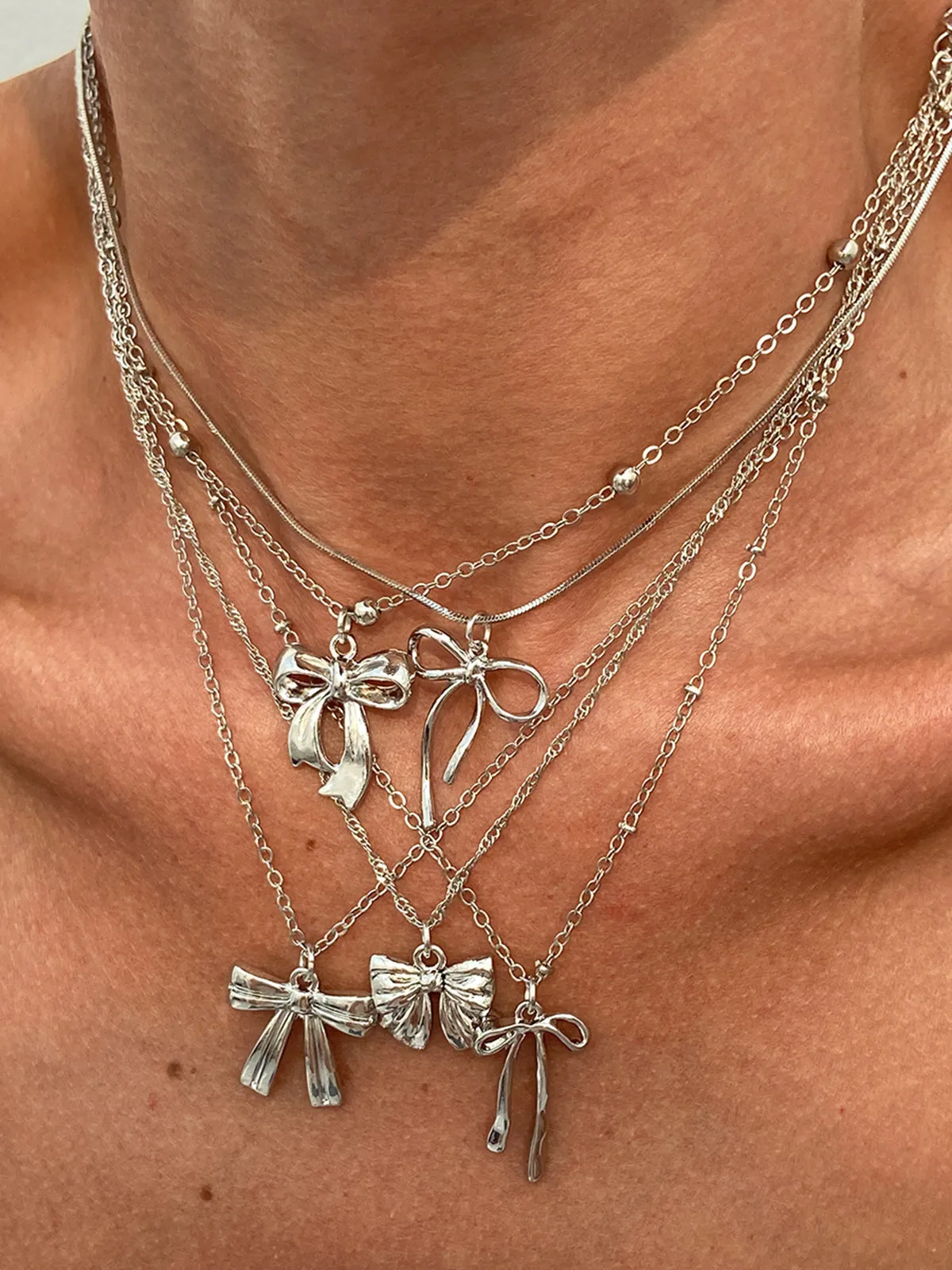 5pcs Bow Charm Necklace Set sold by COMMENSE product image thumbnail 5