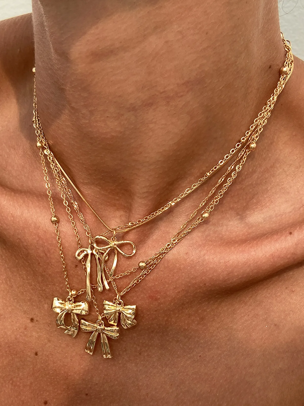 5pcs Bow Charm Necklace Set sold by COMMENSE product image thumbnail 4