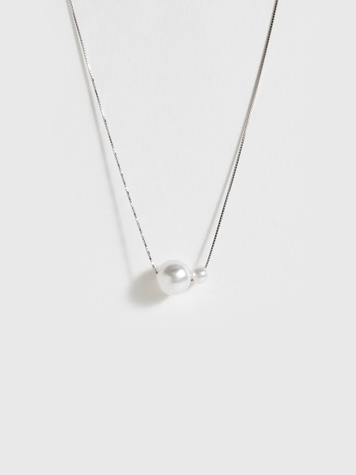 Dual Pearl Pendant Necklace sold by COMMENSE