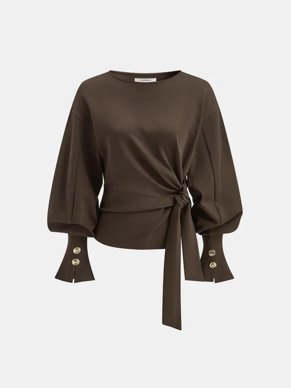 Twist Knot Balloon Sleeve Sweatshirt sold by COMMENSE