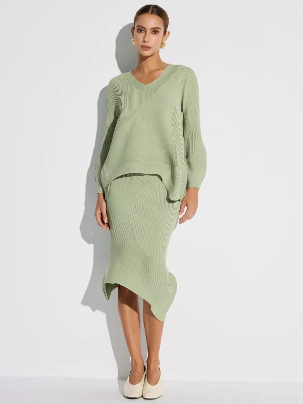 Textured Asymmetric Hem Knit Midi Skirt sold by COMMENSE