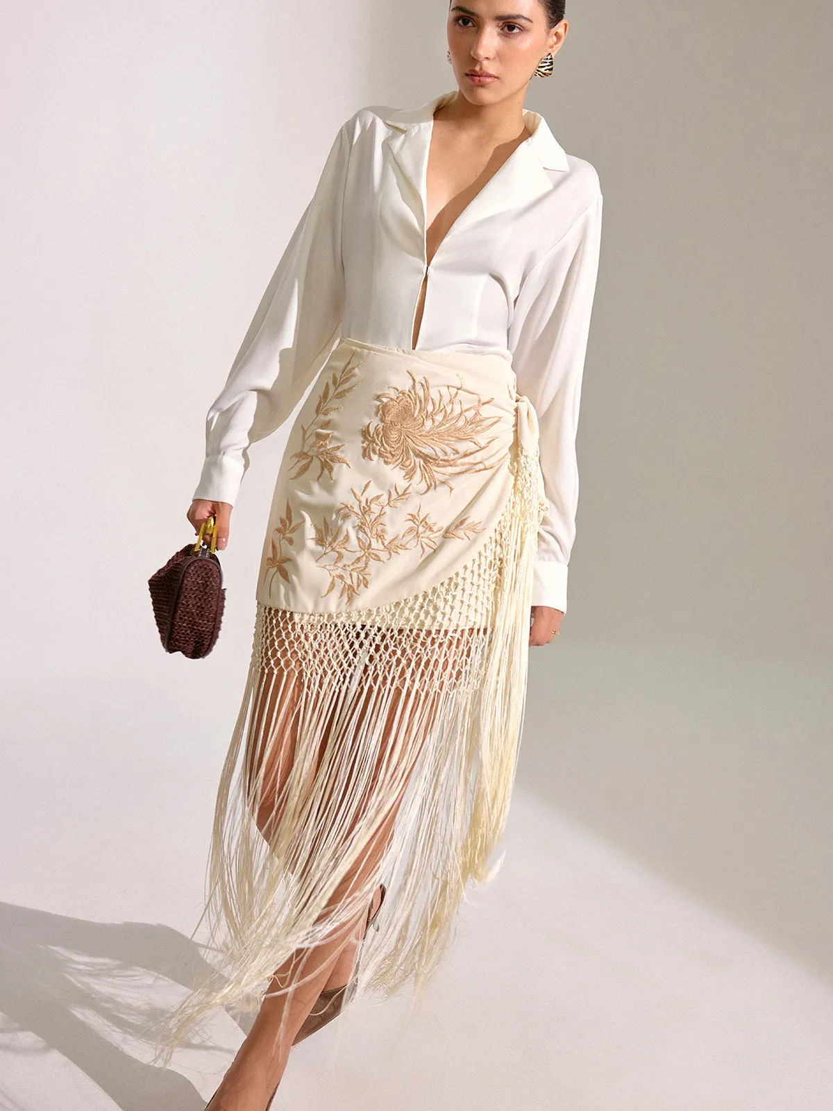 Floral Embroidered Fringe Mini Skirt sold by COMMENSE