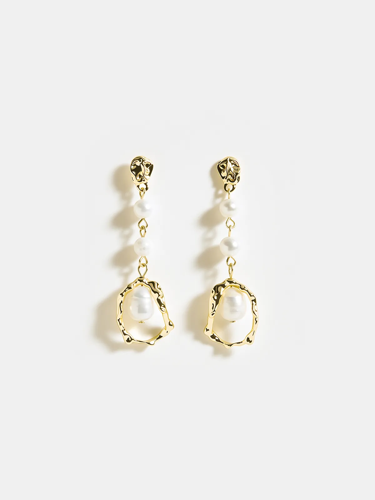 Pearl Golden Dangle Earrings sold by COMMENSE