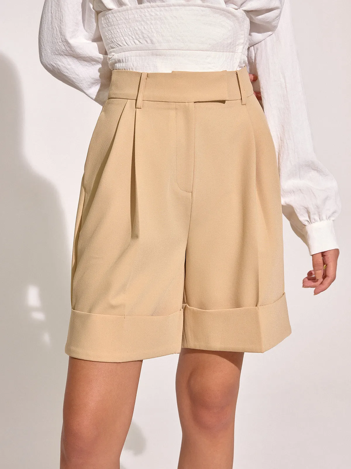 Pocket Mid-Waist Pleated Cuffed Shorts sold by COMMENSE