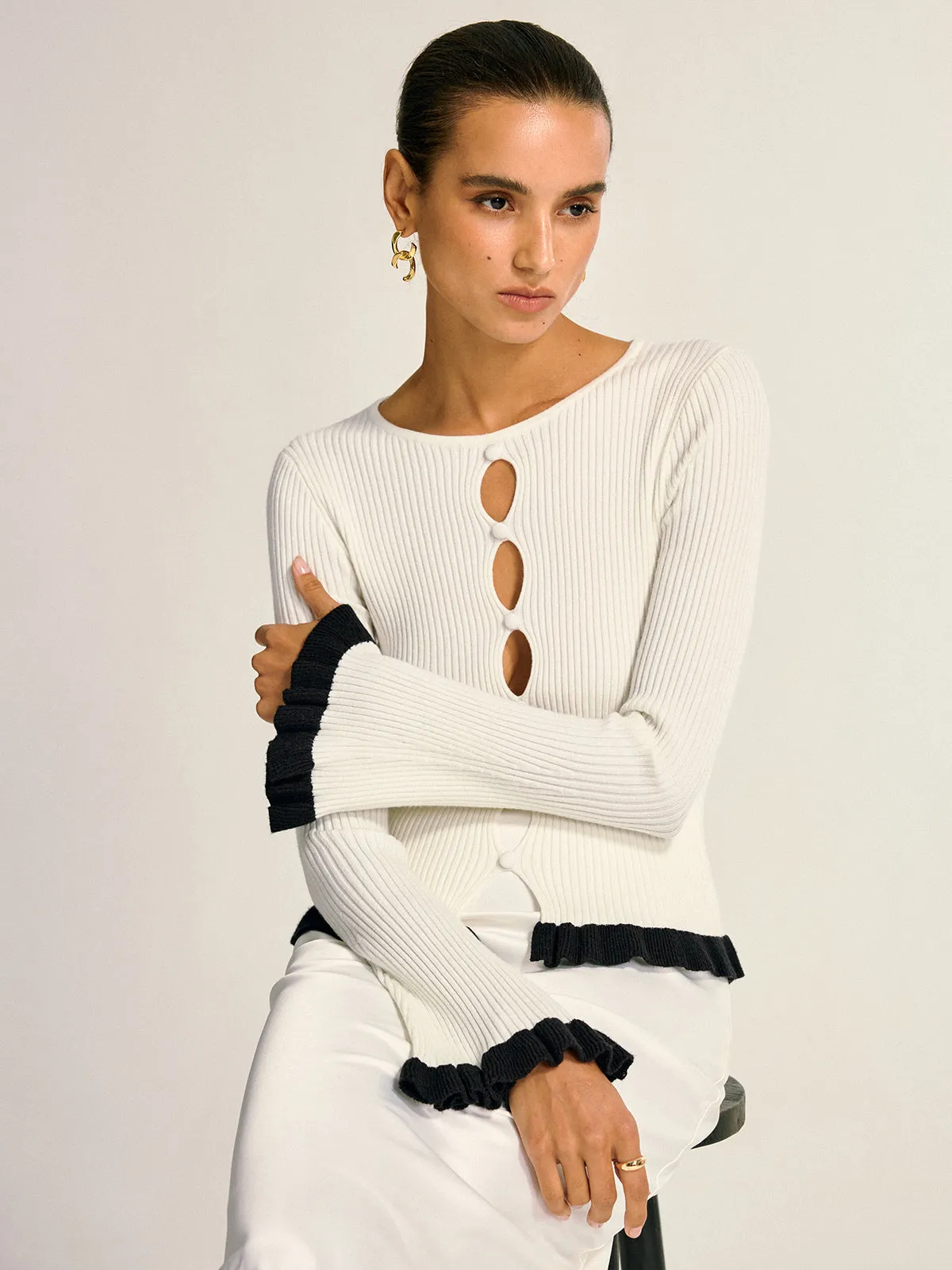 Contrast Ruffle Trim Cut-Out Knit Top sold by COMMENSE