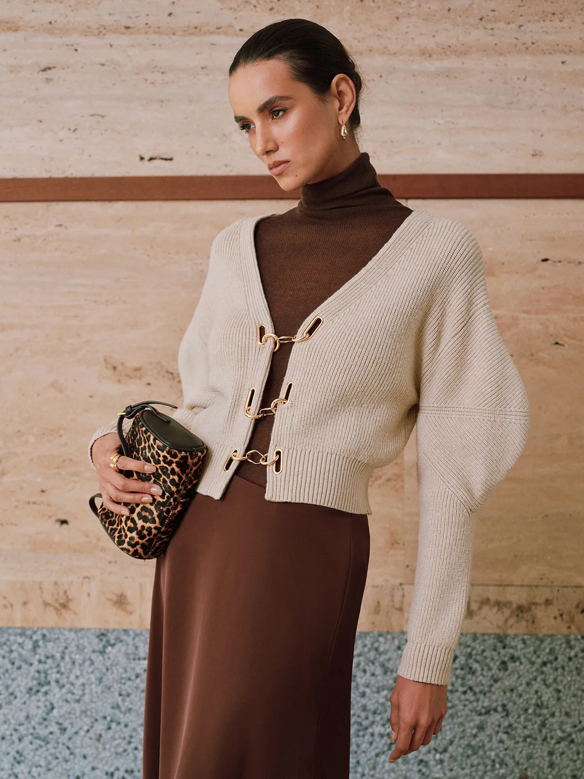 Puff Sleeve Chain Closure Knit Cardigan sold by COMMENSE