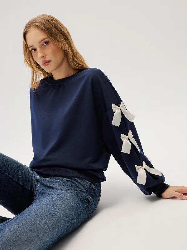 Crew Neck Bow Accent Sweatshirt sold by COMMENSE