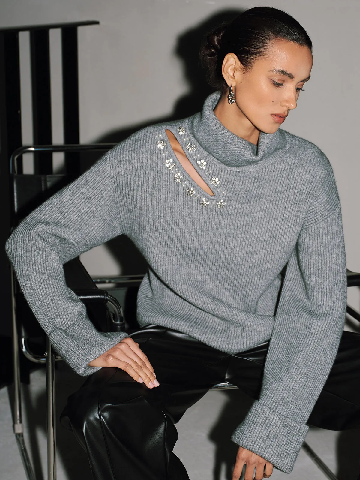 Crystal-Embellished Cut-Out Turtleneck Sweater sold by COMMENSE