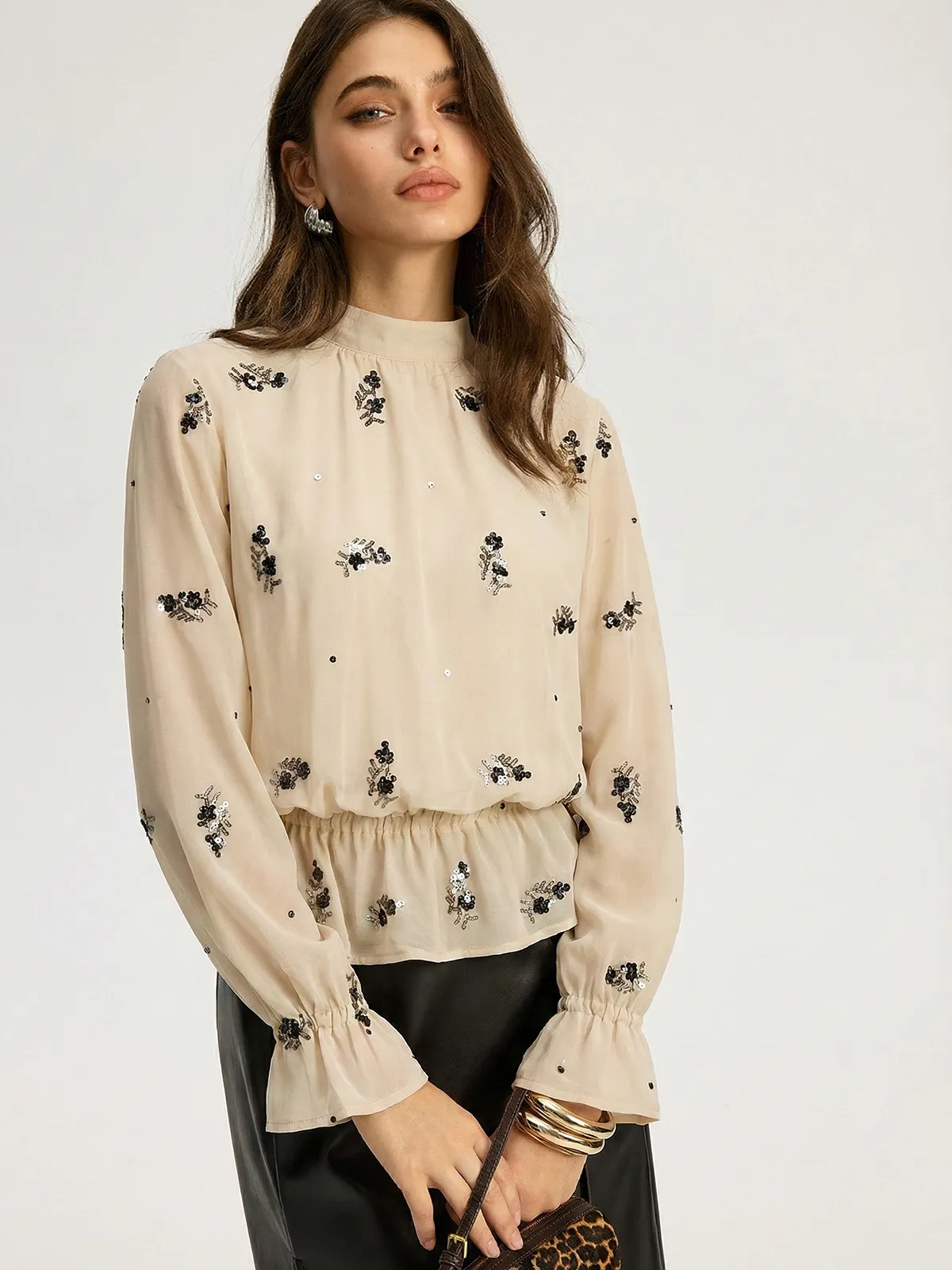 Sequin Floral Mock Neck Smocked Waist Blouse sold by COMMENSE