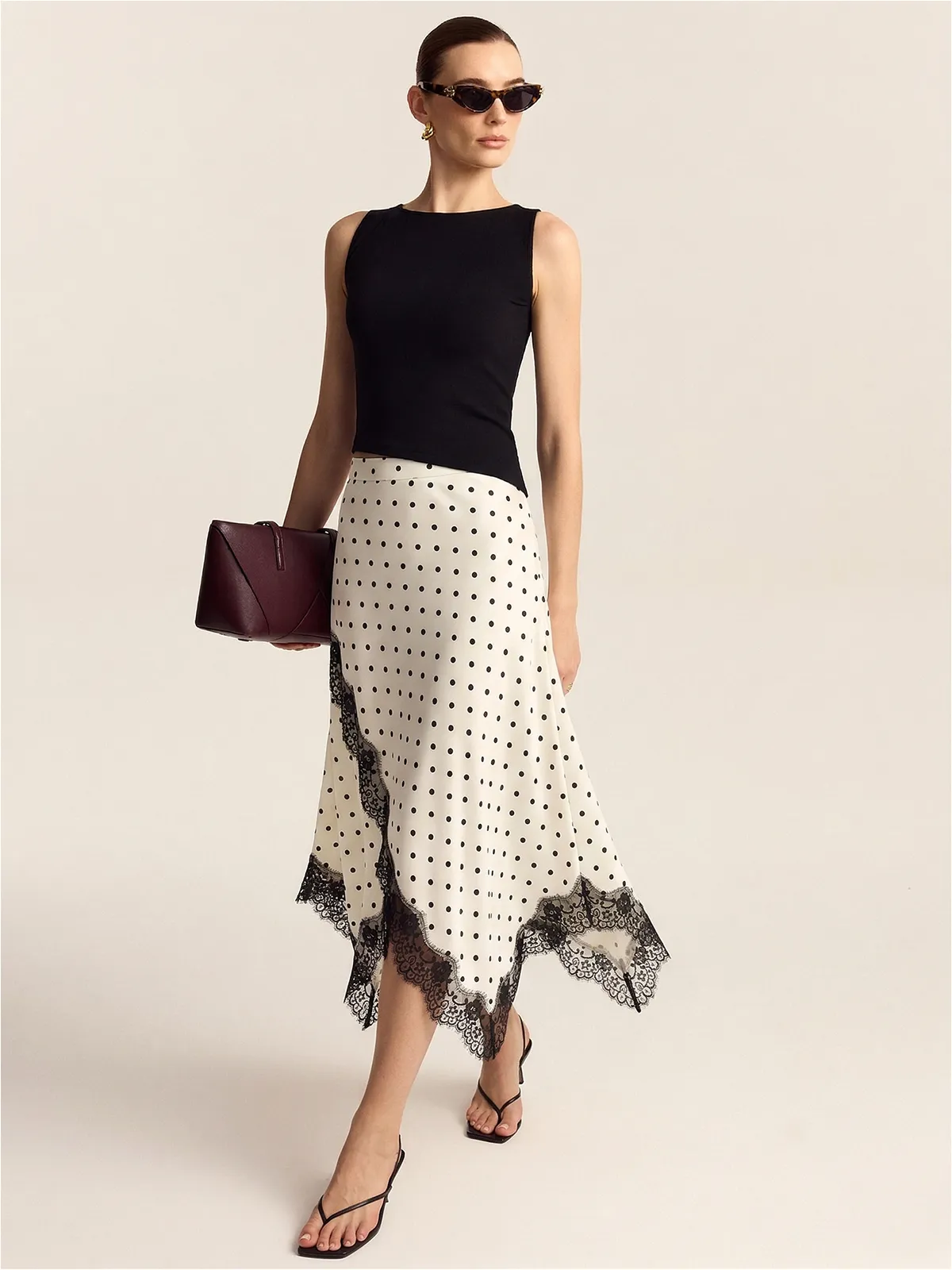 Polka Dot Lace Trim Asymmetric Midi Skirt sold by COMMENSE