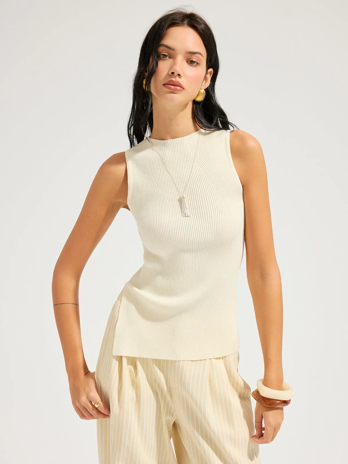 Slim Fit Ribbed Sleeveless Knit Top sold by COMMENSE