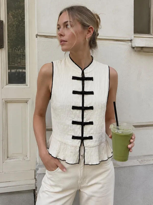 Frog Button Contrast Piping Textured Peplum Top made by COMMENSE