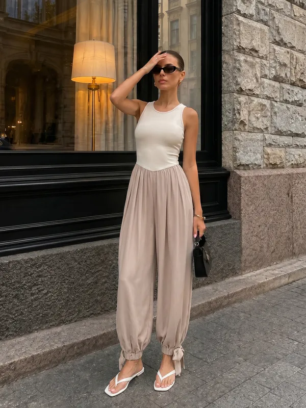 Two-Tone Sleeveless Tie Cuff Balloon Jumpsuit made by COMMENSE