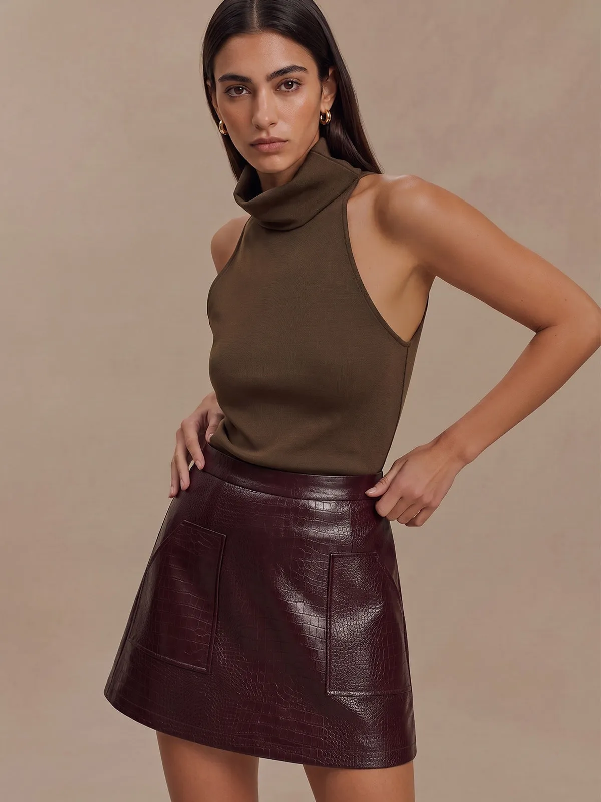 Croc Embossed Faux Leather Mini Skirt sold by COMMENSE