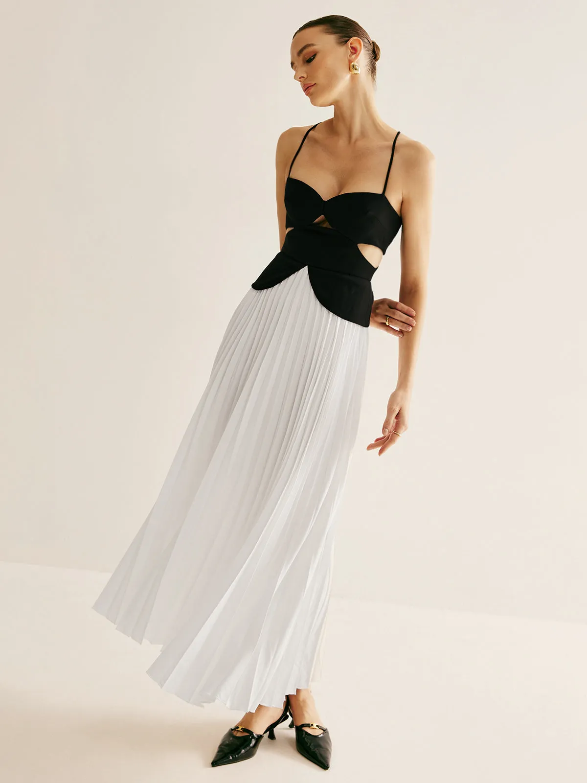 Two Tone Panel Cutout Pleated Dress sold by COMMENSE