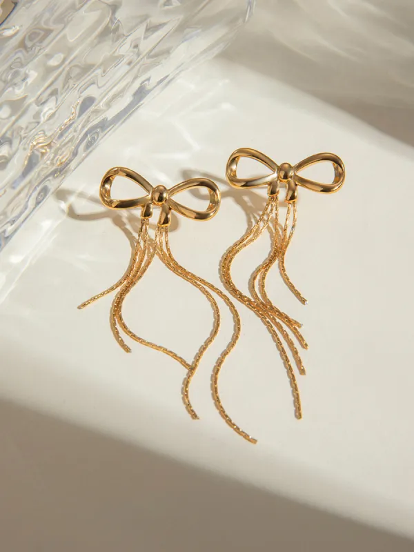 Golden Bow Earrings sold by COMMENSE