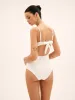 Pearl Cutout Knotted One Piece Swimsuit sold by COMMENSE
