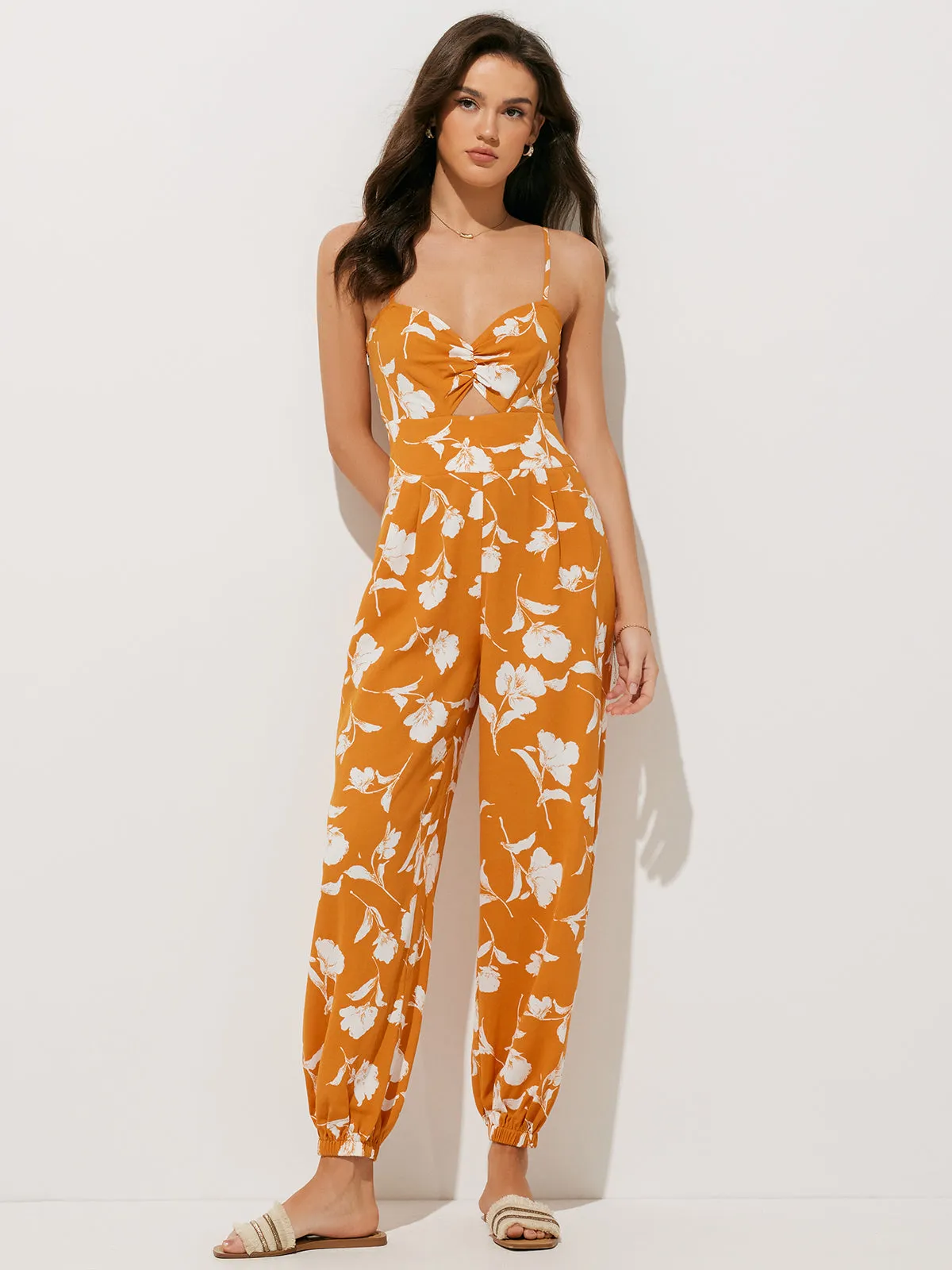 Floral Hollow Out Jumpsuit sold by COMMENSE