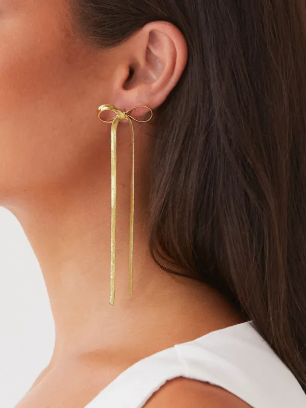 Metal Ribbon Bow Earrings sold by COMMENSE