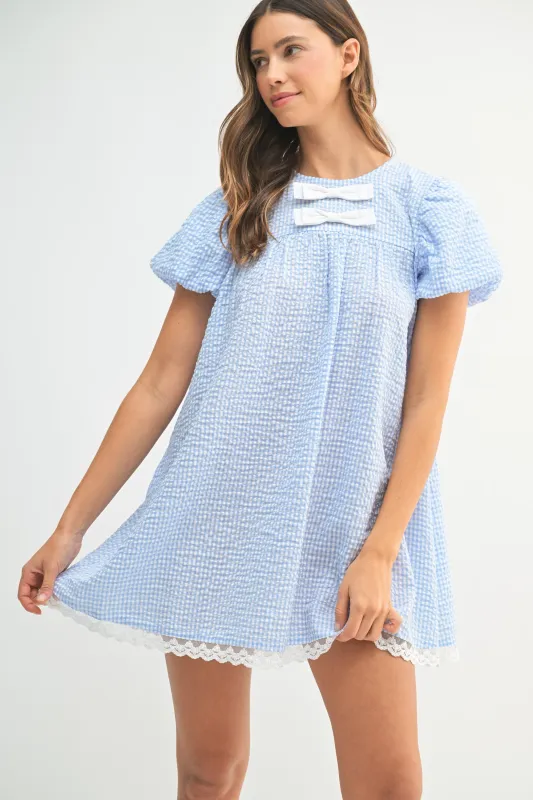 BEATRICE GINGHAM MINI DRESS WITH BOW DETAIL sold by MABLE