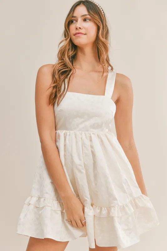 KORA TEXTURED BOW TIE BACK MINI DRESS made by MABLE