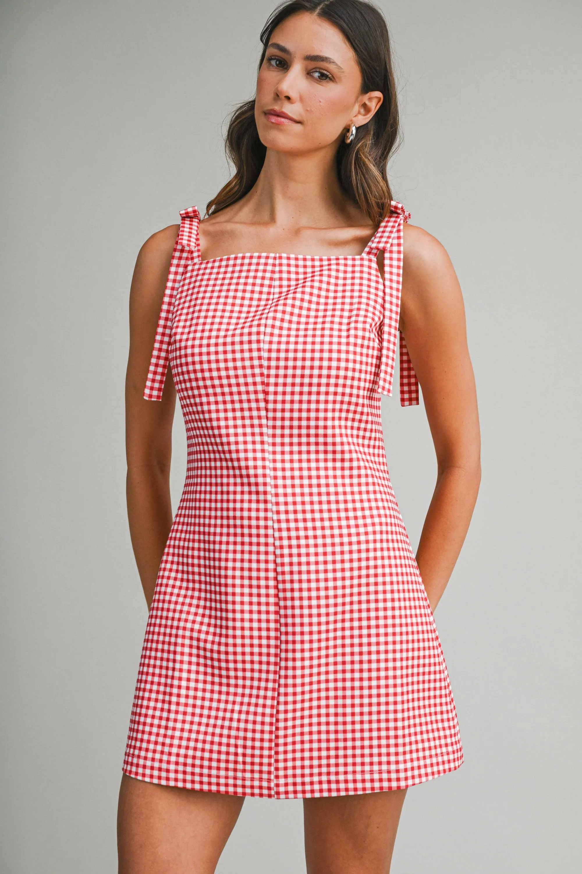 CECILIA GINGHAM MINI DRESS WITH BOW DETAIL sold by MABLE