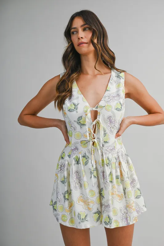 DAISY PRINTED SLEEVELESS TIE FRONT ROMPER made by MABLE