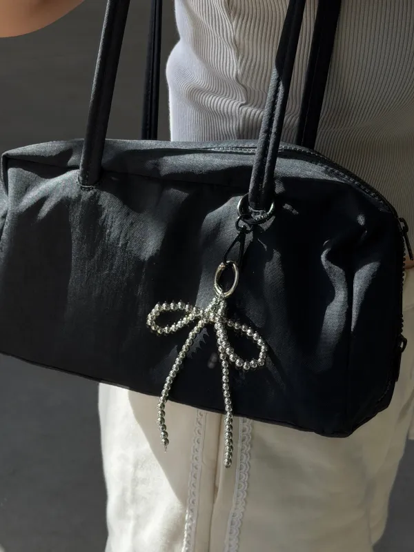 Chrome Bow Keychain sold by Things Between