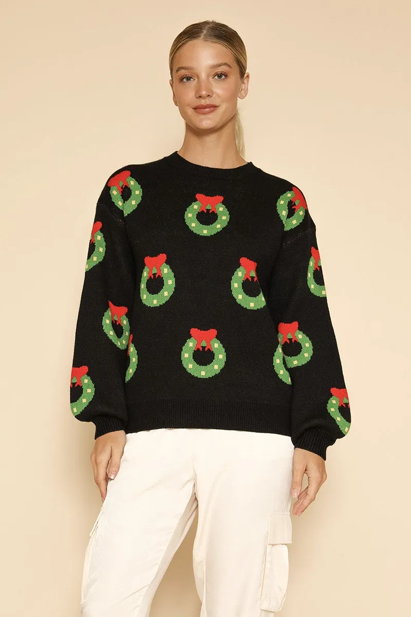 All over wreath holiday knit sweater sold by Miss Sparkling