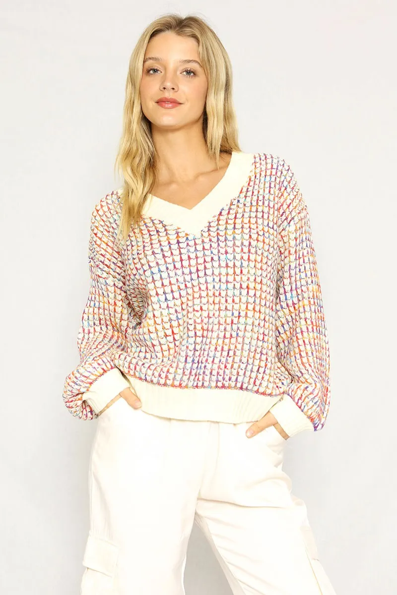 Multicolored knit sweater sold by Miss Sparkling