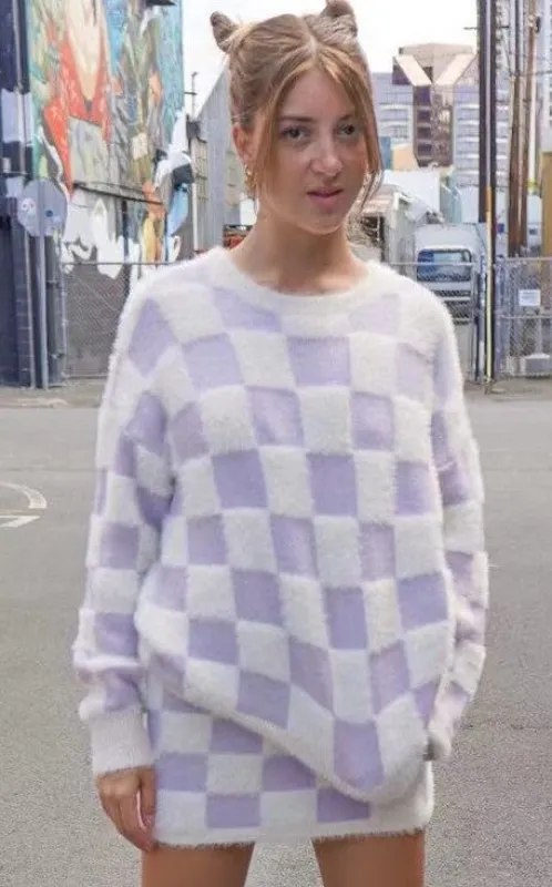 Fuzzy checkered sweater sold by Miss Sparkling