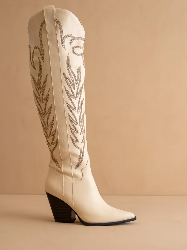 The Bronco | Off White Knee High Embroidered Cowboy Boot sold by Oasis Society