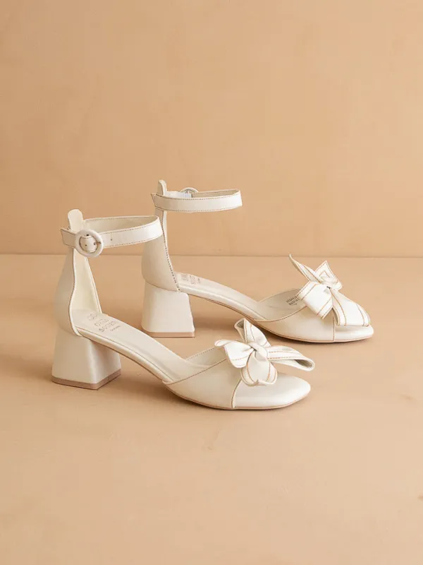 The Vigo | White Low Block Heel With A Sweet Bow *final sale* sold by Oasis Society
