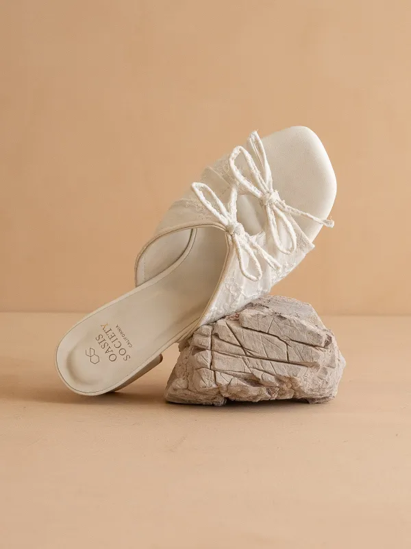 The Emerald | White Double Bow Peep Hole Block Heel sold by Oasis Society