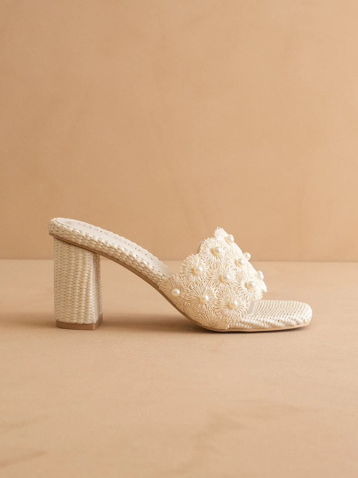 The Holland | Ivory Pearl Raffia Block Heel Mule sold by Oasis Society