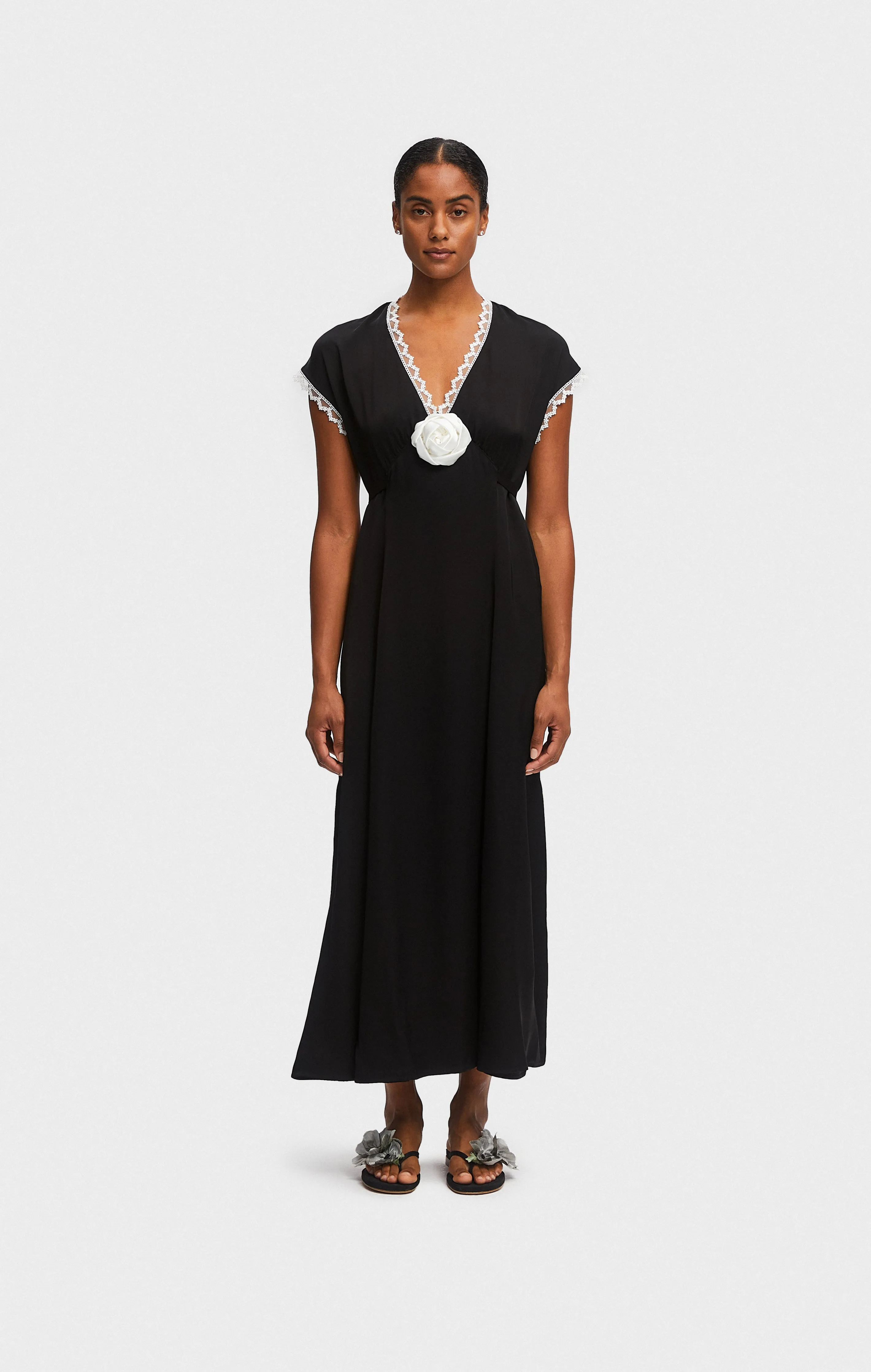 The Genus Rosa Satin Dress in Black sold by Sleeper