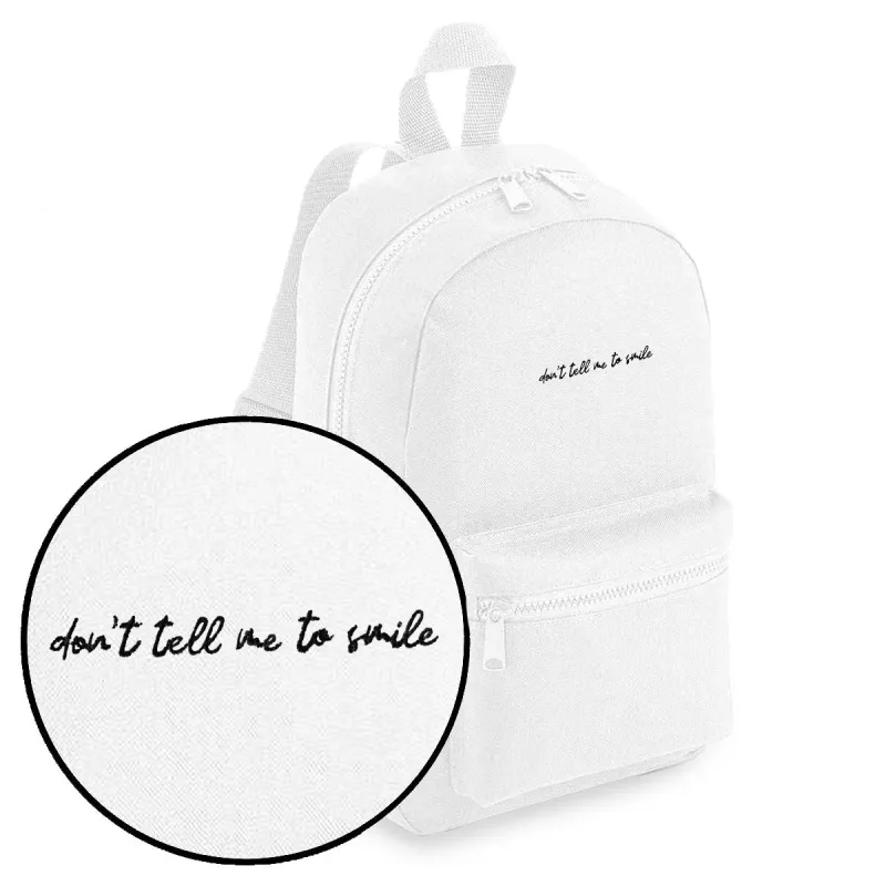 Don't Tell Me To Smile Embroidered Mini Backpack sold by The Spark Company