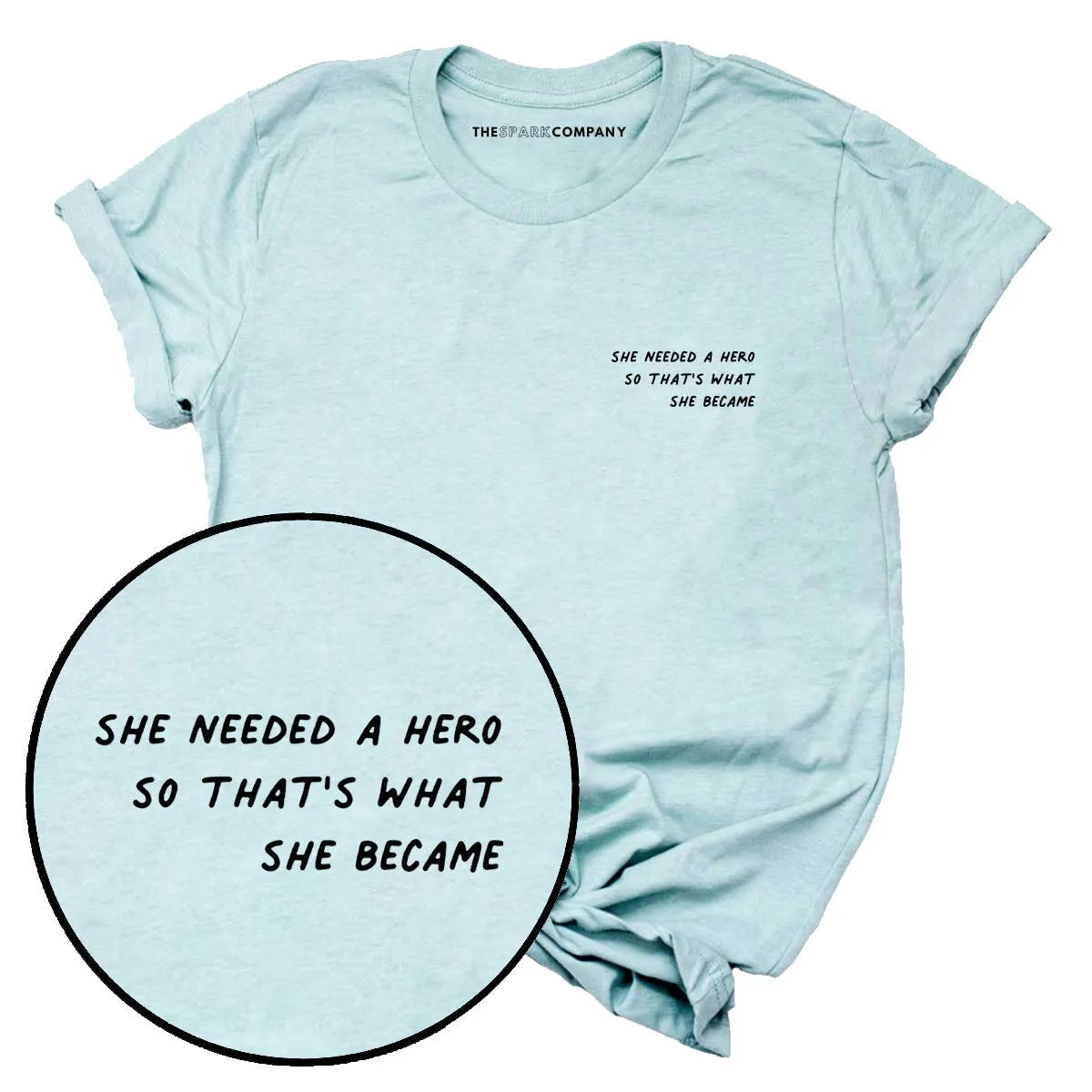 She Needed A Hero So That's What She Became T-Shirt sold by The Spark Company
