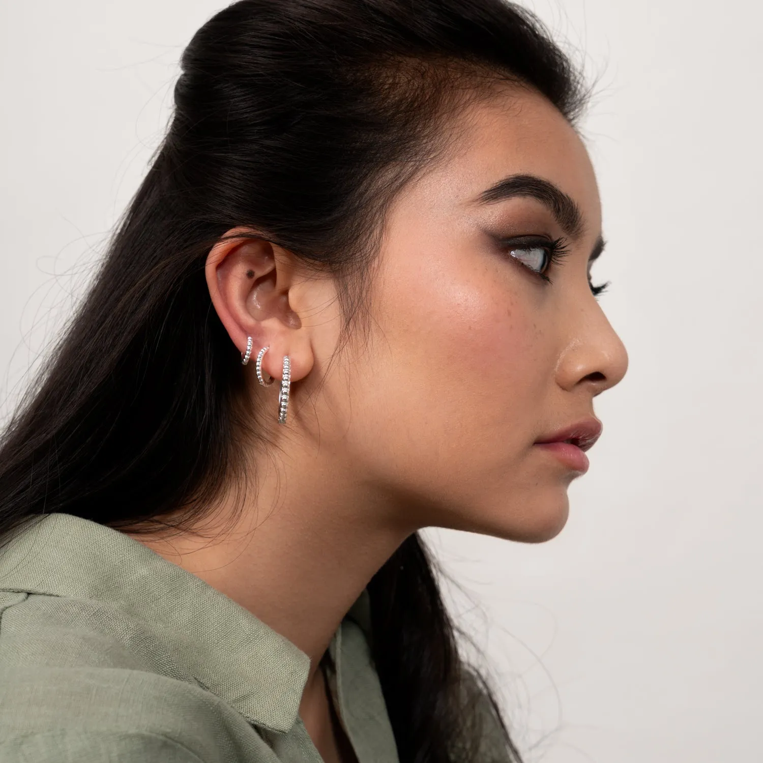 Small Dotty Huggie Hoops sold by Dower & Hall product image thumbnail 4