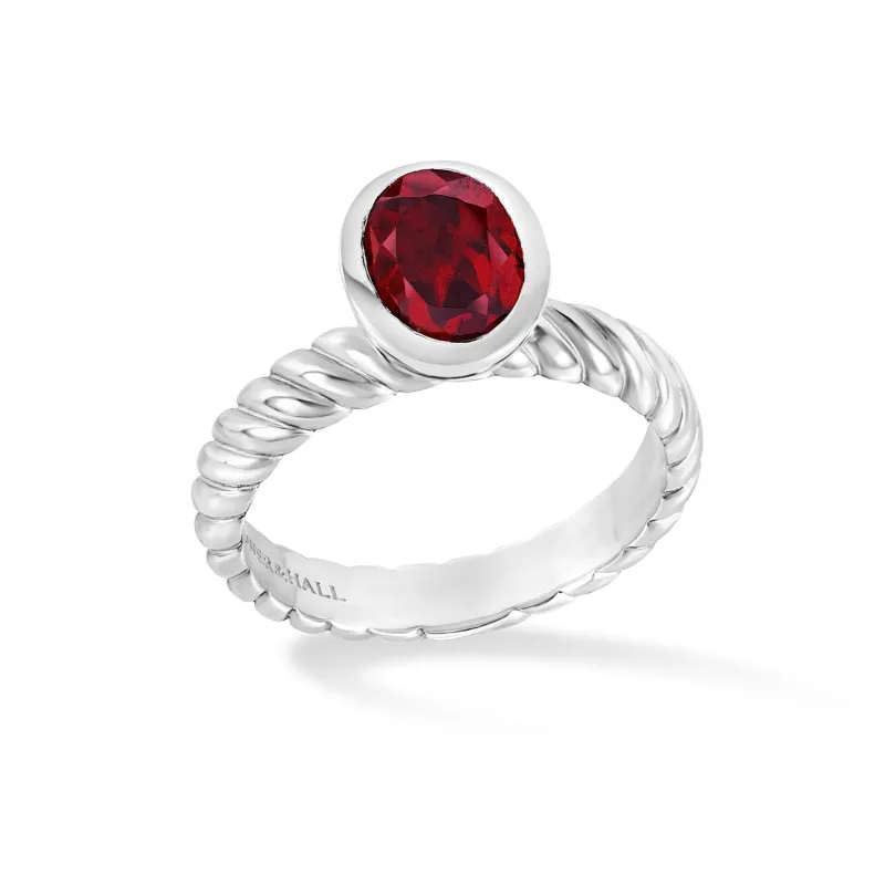 Oval Garnet Twist Twinkle Ring sold by Dower & Hall